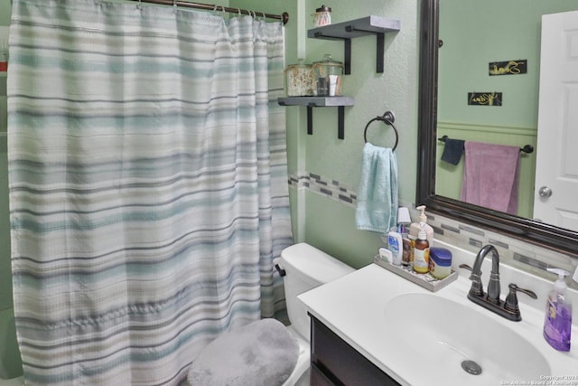 bathroom featuring vanity, decorative backsplash, and a shower with curtain