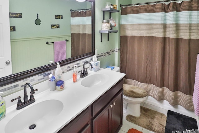 bathroom with toilet, tile patterned flooring, decorative backsplash, and vanity