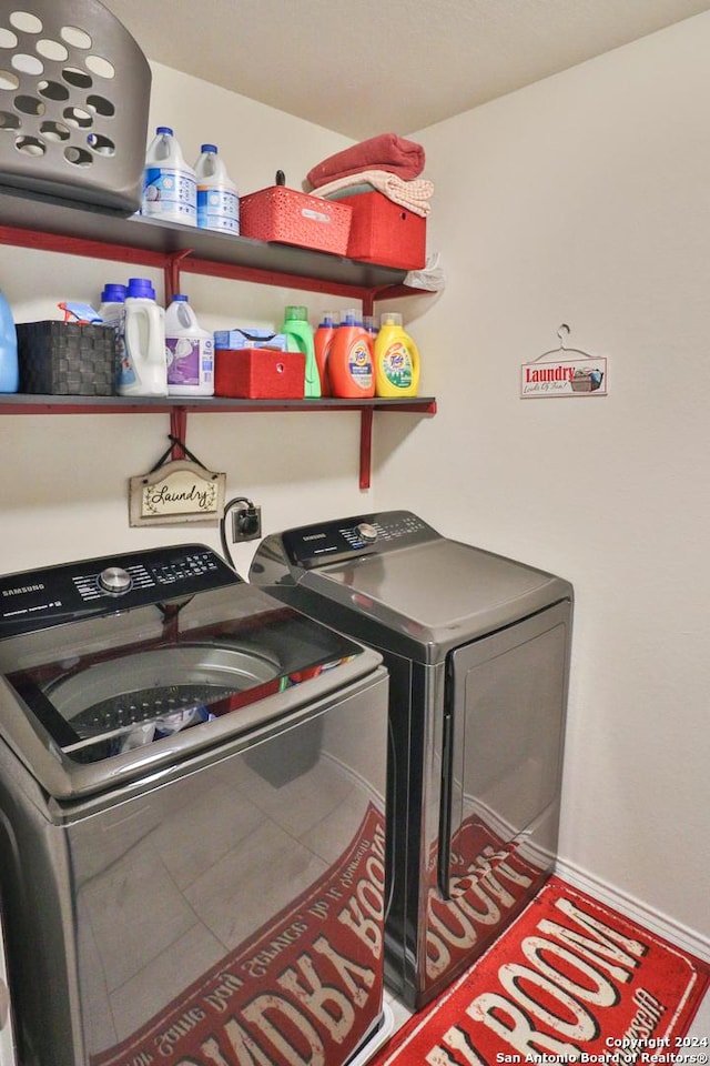 washroom with washer and clothes dryer