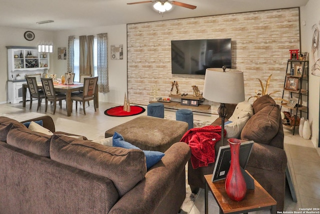 tiled living room with ceiling fan