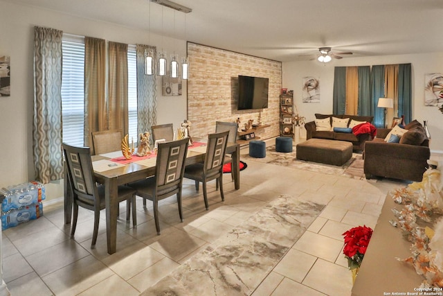 dining area with ceiling fan and light tile patterned floors