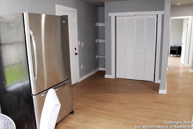 kitchen featuring light wood-type flooring and stainless steel refrigerator