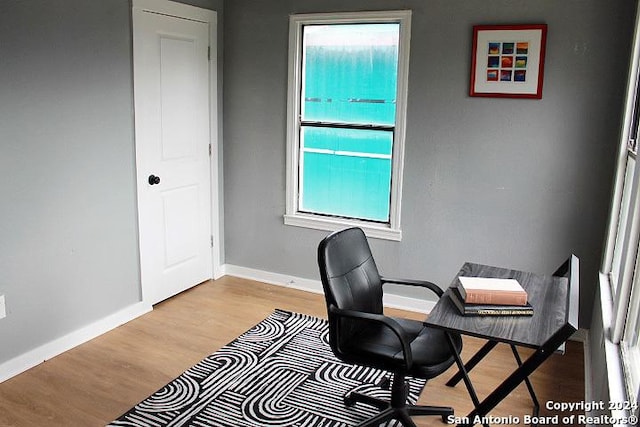 office space with light hardwood / wood-style flooring