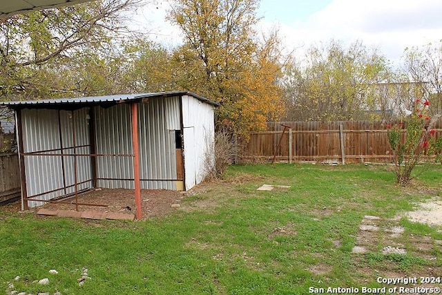 view of outbuilding with a lawn