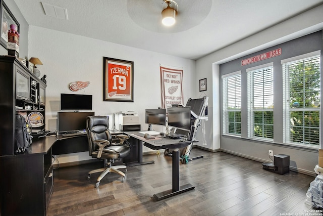 office space with a textured ceiling, dark hardwood / wood-style flooring, and ceiling fan