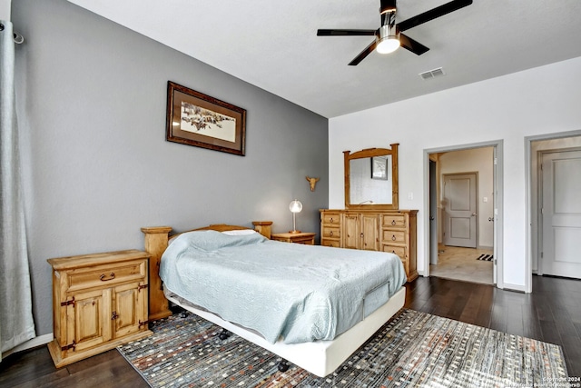 bedroom with ceiling fan and dark wood-type flooring