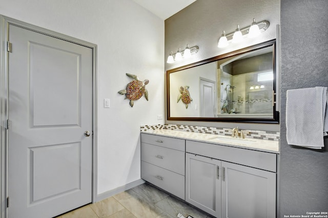 bathroom with vanity and a shower