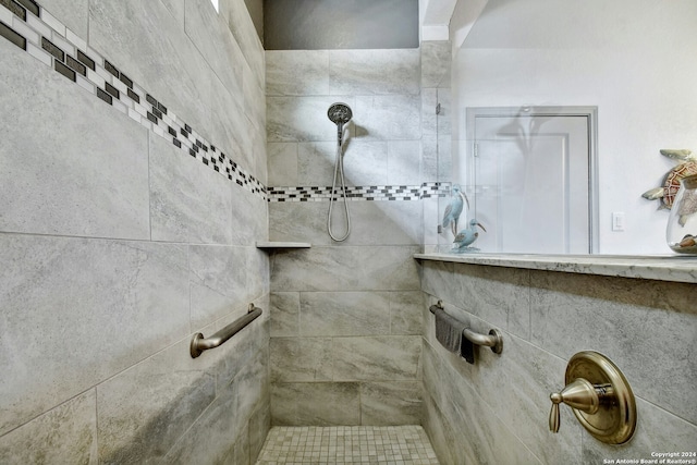 bathroom with tiled shower