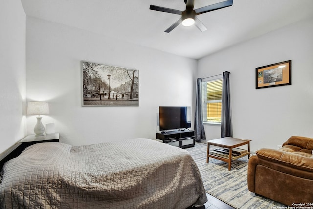 bedroom featuring light hardwood / wood-style floors and ceiling fan