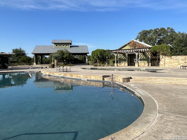 view of pool with a gazebo and a patio area