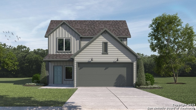 view of front of home featuring a garage and a front yard