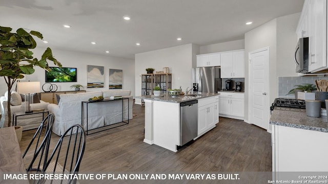 kitchen with stainless steel appliances, white cabinetry, a kitchen island with sink, and dark wood-type flooring