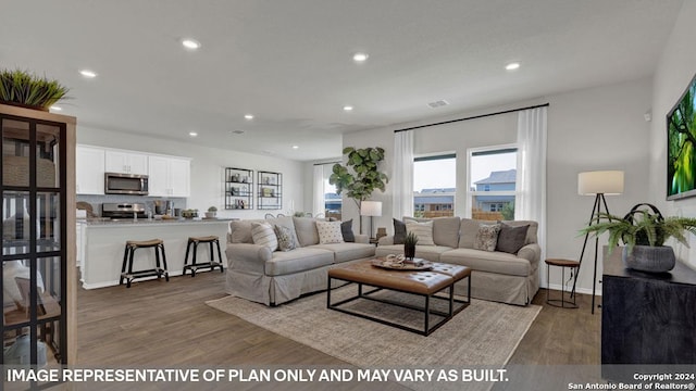 living room with dark hardwood / wood-style floors