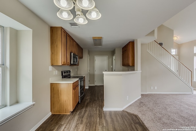 kitchen featuring electric range, dark hardwood / wood-style flooring, and vaulted ceiling