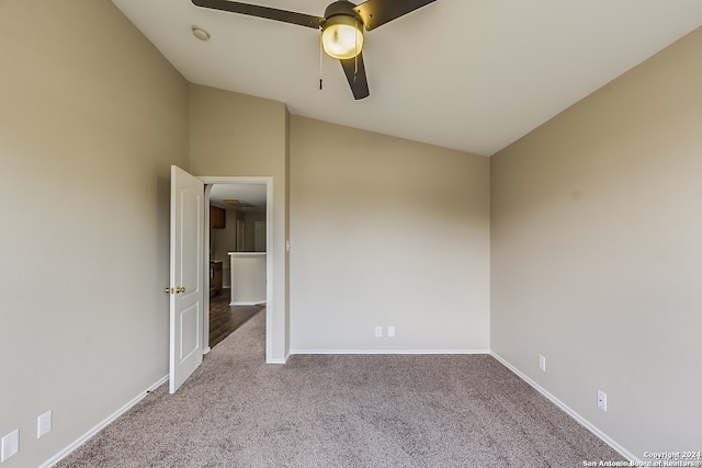 unfurnished room featuring light carpet, ceiling fan, and lofted ceiling