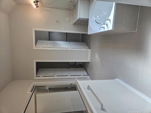 kitchen featuring white cabinets