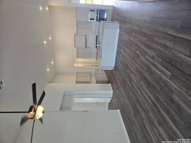 interior space with white cabinets and dark hardwood / wood-style floors