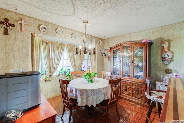 dining area with an inviting chandelier