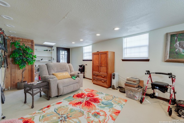 living room with a textured ceiling