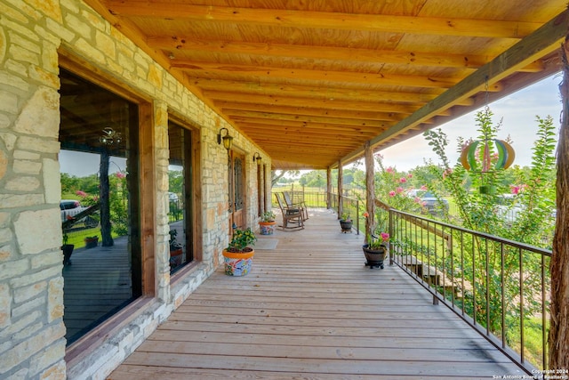 wooden terrace with a porch