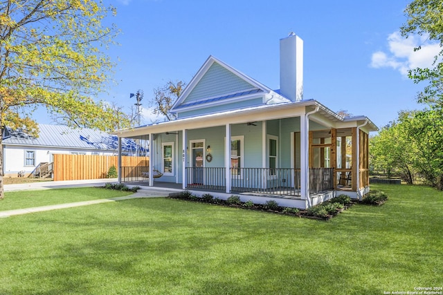 country-style home featuring a porch and a front lawn