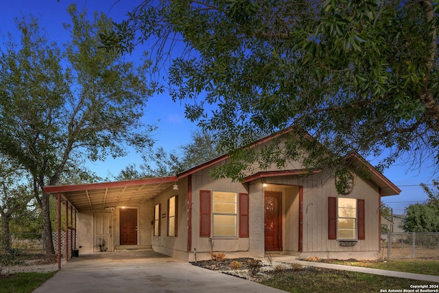 view of front of property featuring a carport