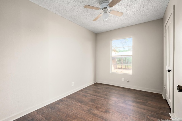 unfurnished bedroom featuring a textured ceiling, dark hardwood / wood-style floors, and ceiling fan