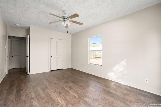 unfurnished bedroom featuring a textured ceiling, dark hardwood / wood-style floors, and ceiling fan