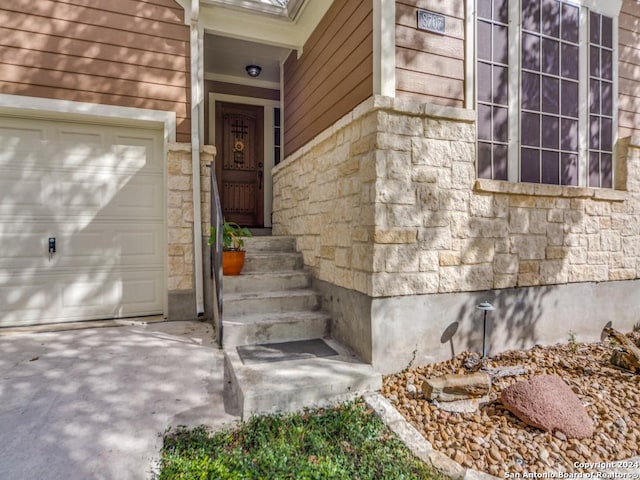 property entrance with a garage