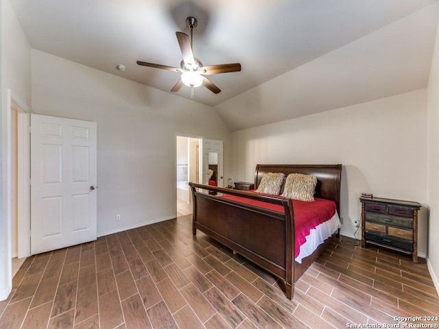 bedroom featuring ensuite bathroom, vaulted ceiling, and ceiling fan