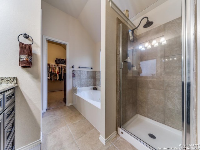 bathroom with separate shower and tub and vaulted ceiling