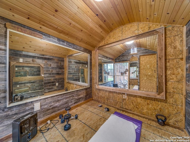 bathroom featuring wooden ceiling, vaulted ceiling, and wooden walls