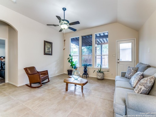 living room featuring vaulted ceiling, ceiling fan, and light tile patterned flooring