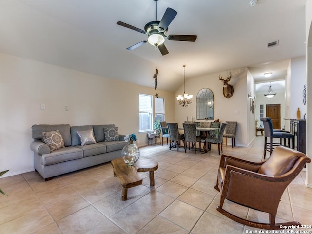 tiled living room featuring ceiling fan with notable chandelier and vaulted ceiling