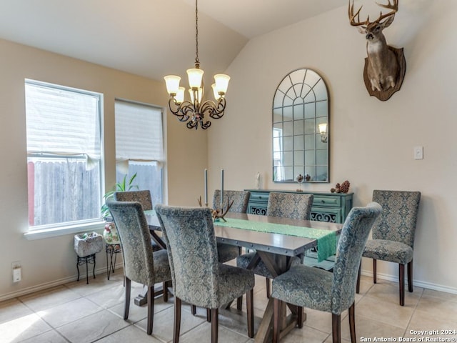 dining space featuring vaulted ceiling, a notable chandelier, and light tile patterned flooring