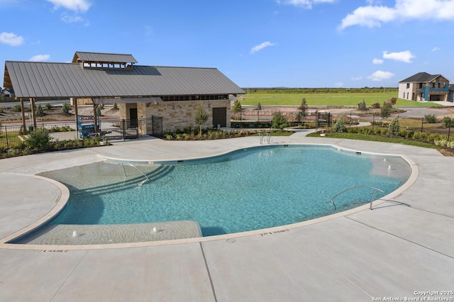 view of swimming pool with a patio area