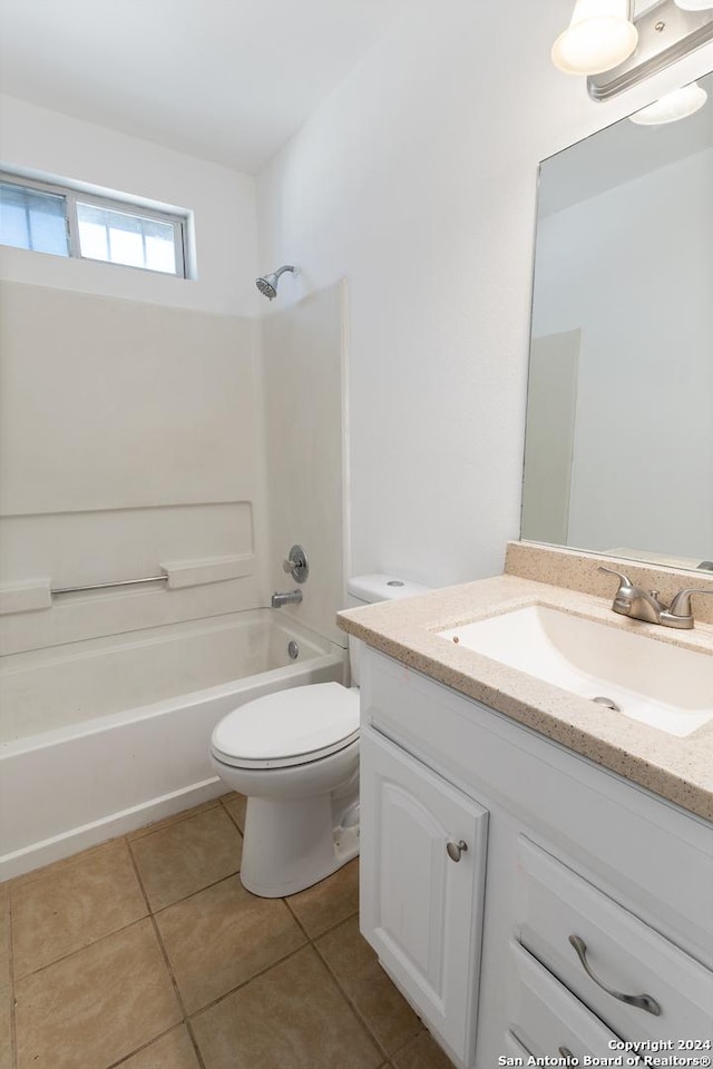 full bathroom with washtub / shower combination, tile patterned flooring, vanity, and toilet