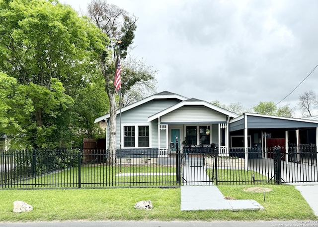 view of front facade featuring a carport, a porch, and a front lawn