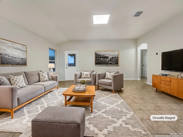 living room with vaulted ceiling