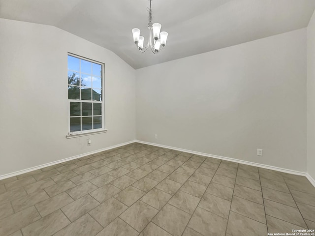 unfurnished room featuring a chandelier, light tile patterned flooring, and vaulted ceiling