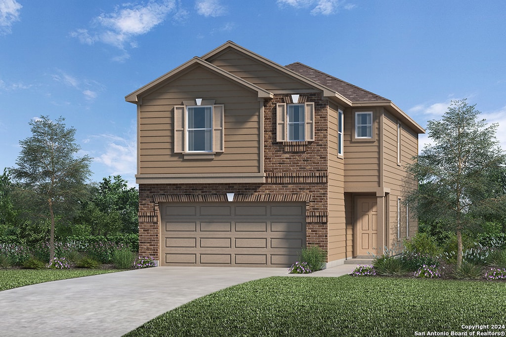 view of front of home with a front lawn and a garage