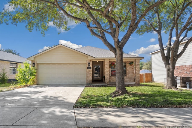 ranch-style home featuring a garage and a front yard