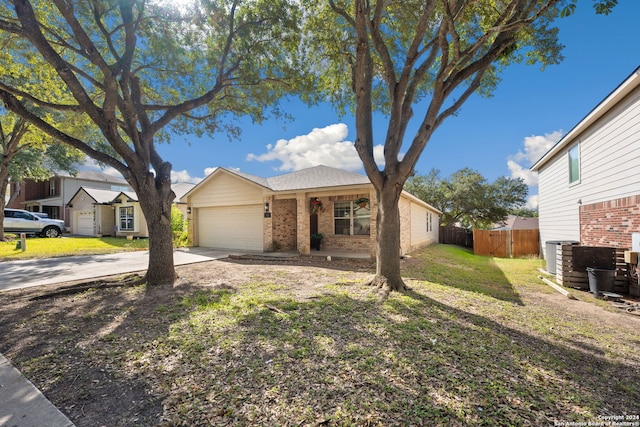 ranch-style house with a front yard and a garage