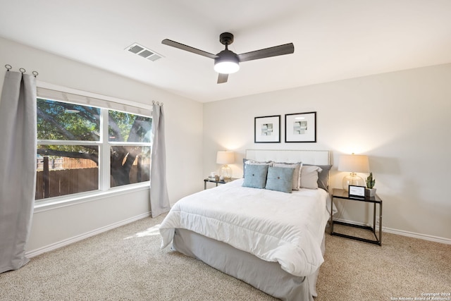 bedroom with light colored carpet and ceiling fan