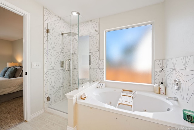 bathroom with plus walk in shower and tile patterned flooring