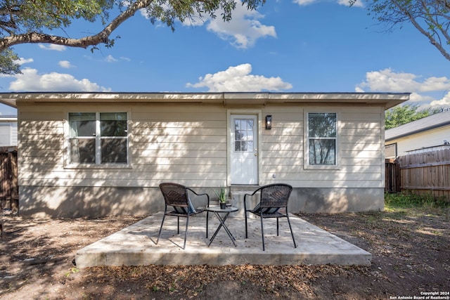 back of property featuring a patio area