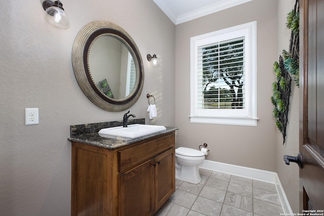 bathroom featuring vanity, toilet, and ornamental molding