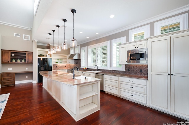 kitchen with dark wood-type flooring, an island with sink, pendant lighting, and appliances with stainless steel finishes