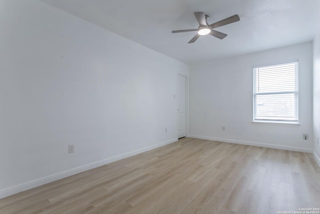 unfurnished room with ceiling fan and light hardwood / wood-style floors