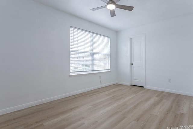 empty room featuring ceiling fan and light hardwood / wood-style floors